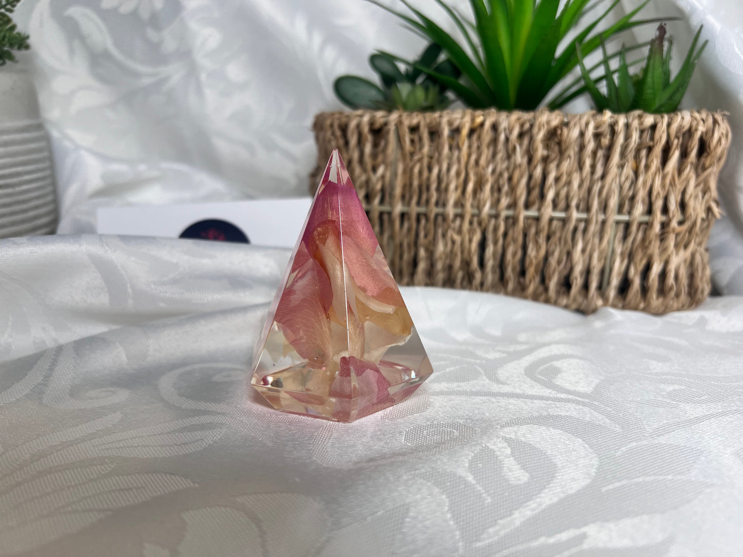 Pink petals inside a resin ring holder